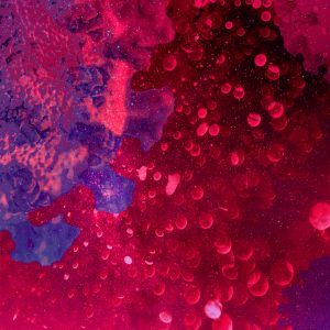 Imagen abstracta de reactivos con bacterias roja y morada